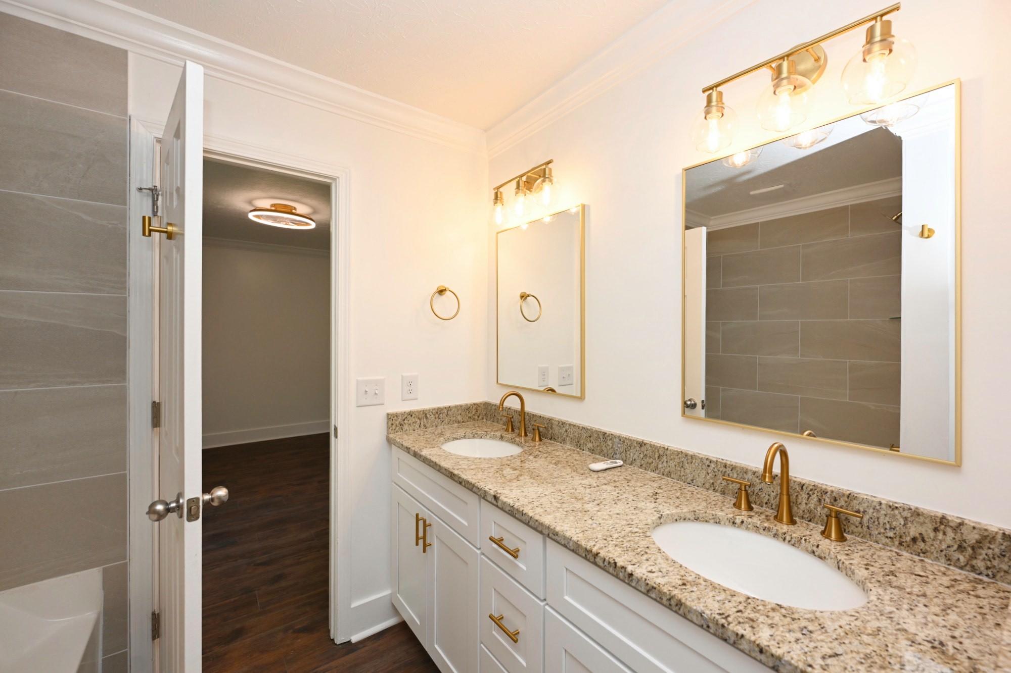 200 Larkin Springs Road Madison, TN 37115 - Photo 66 of 89 a bathroom with a granite countertop sink and a mirror