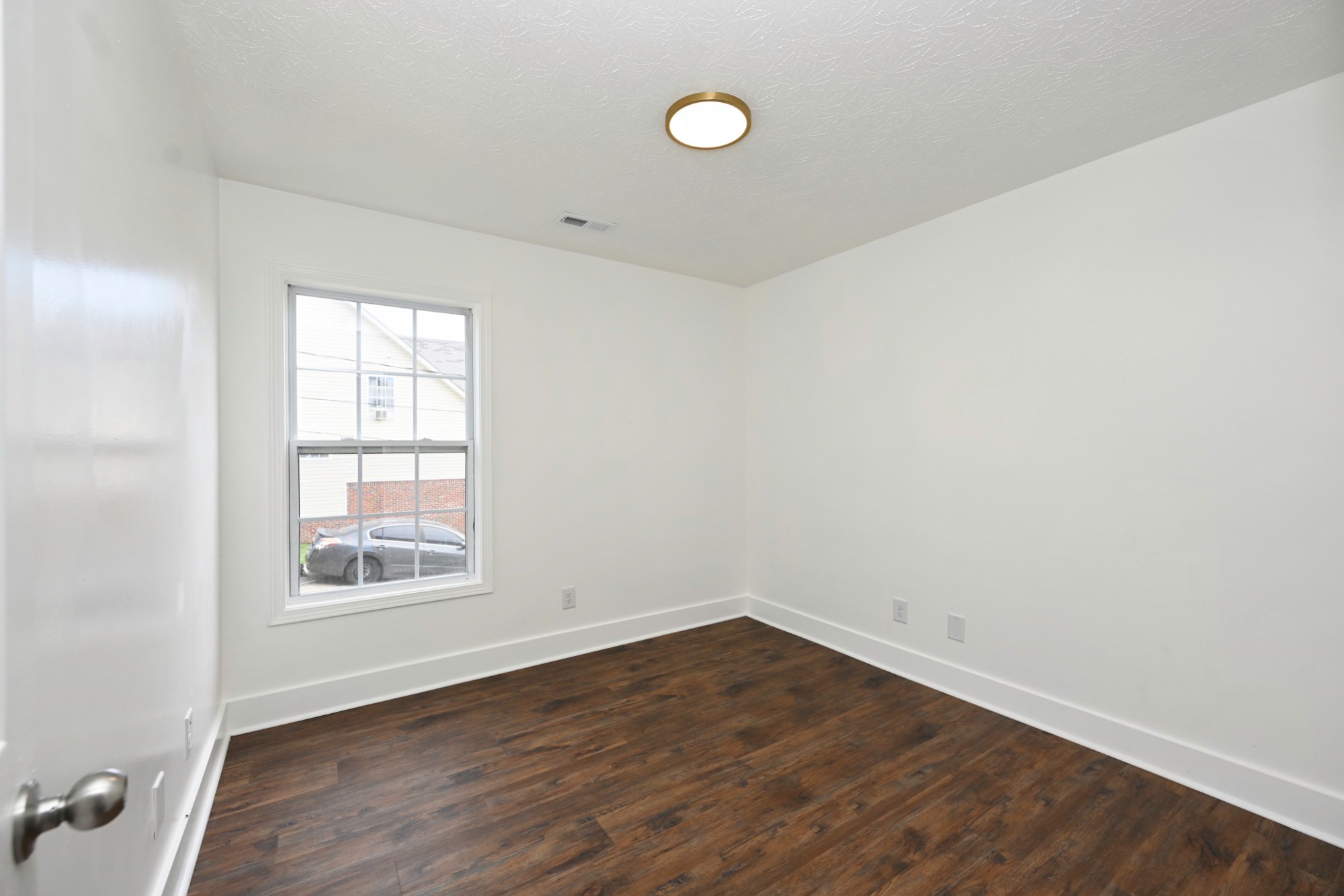 200 Larkin Springs Road Madison, TN 37115 - Photo 73 of 89 an empty room with wooden floor and windows