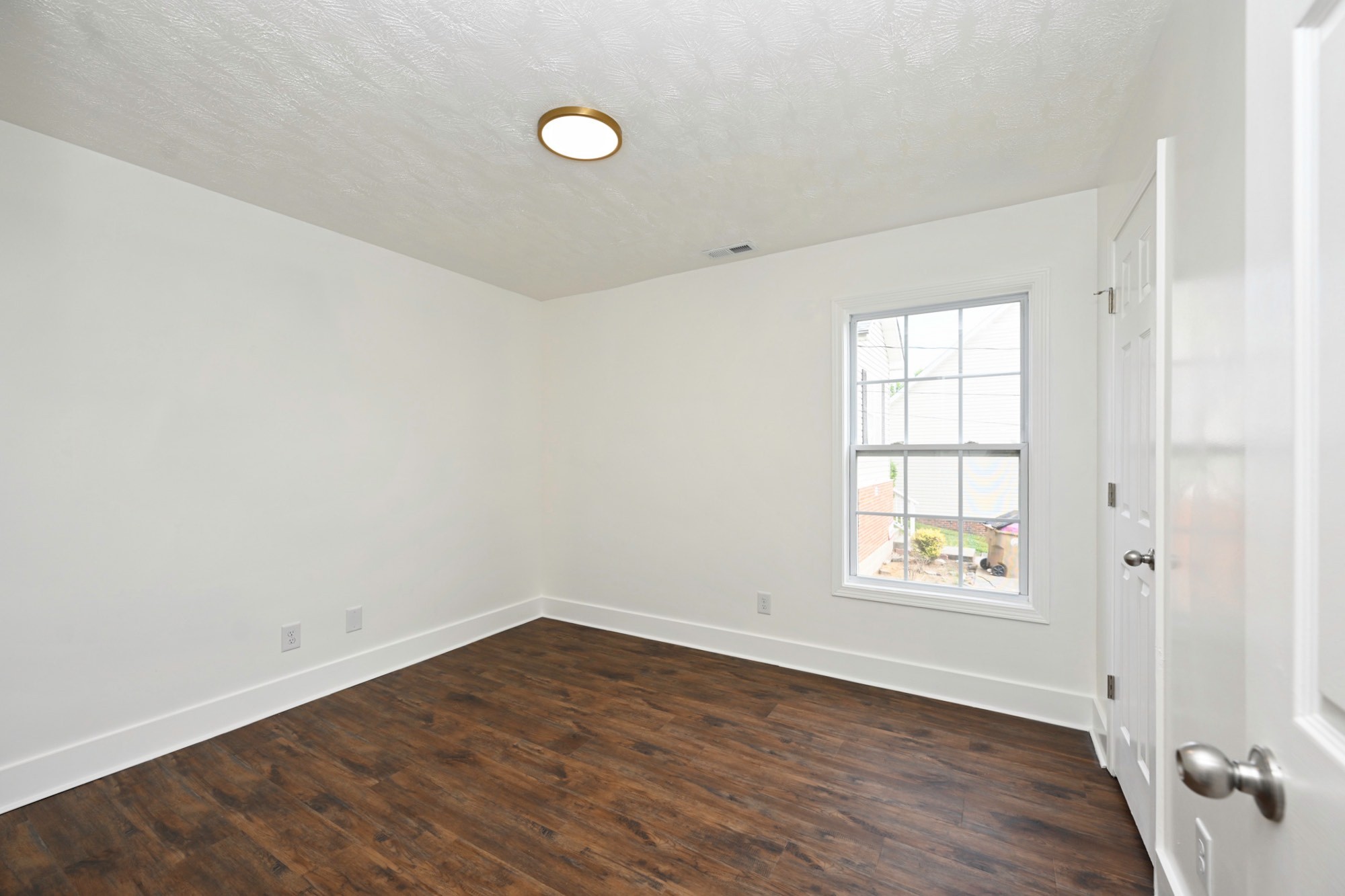 200 Larkin Springs Road Madison, TN 37115 - Photo 75 of 89 an empty room with wooden floor and windows