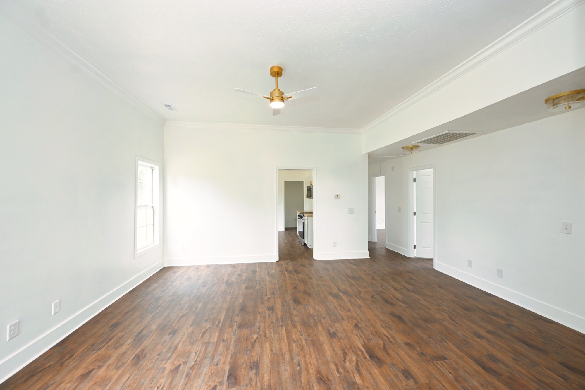 200 Larkin Springs Road Madison, TN 37115 - Photo 86 of 89 a view of empty room with wooden floor and fan
