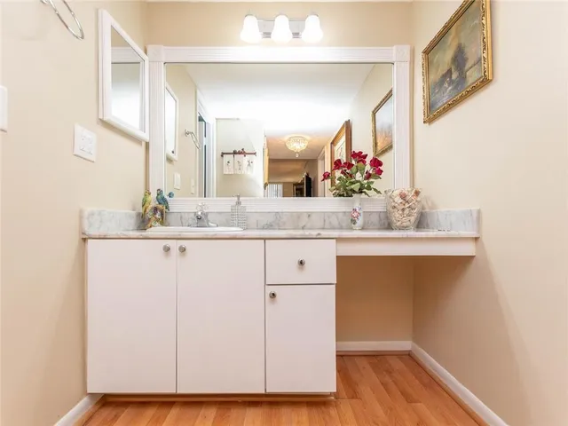 a bathroom with a sink and a mirror