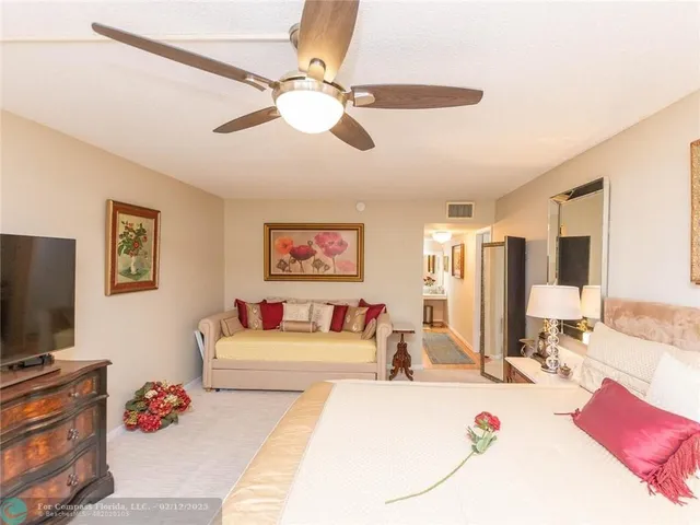 a view of a swimming pool with a yard