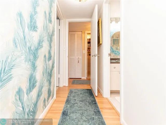 a white toilet sitting next to a bath tub shower curtain