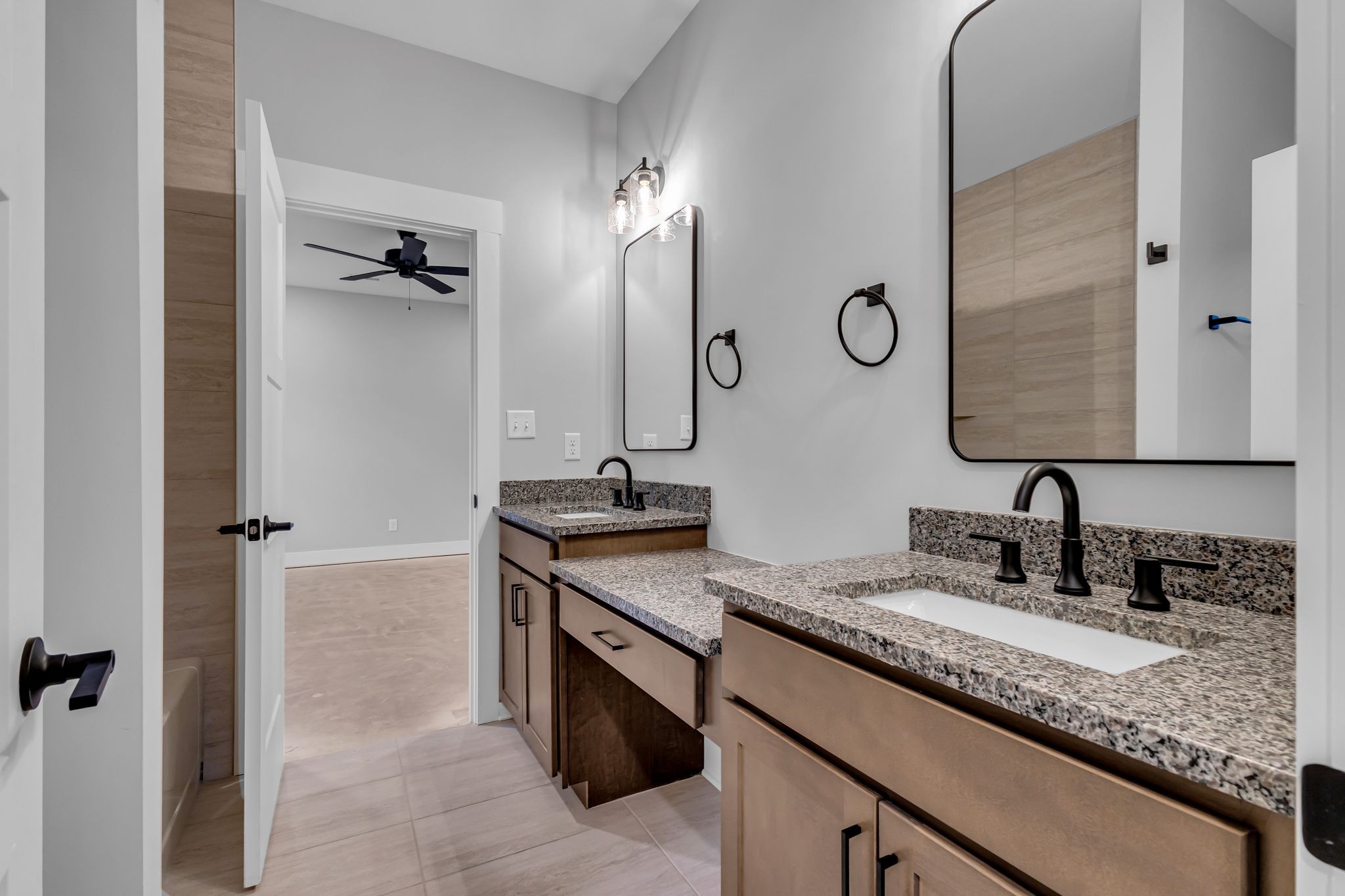 2504 Gentle Rain Road Knoxville, TN 37920 - Photo 23 of 45 a bathroom with a granite countertop sink and a mirror