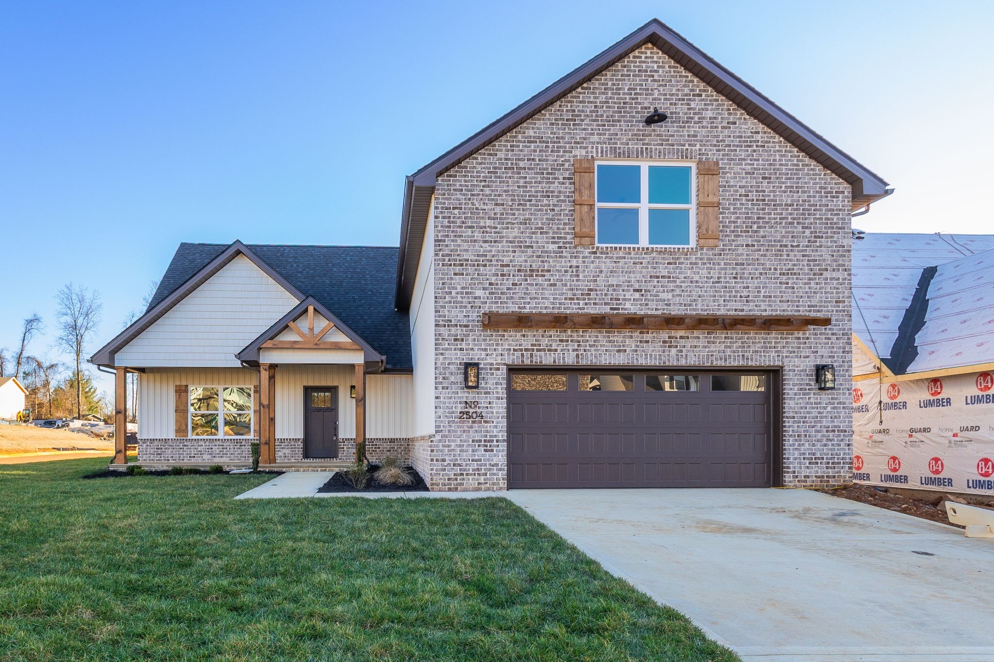 2504 Gentle Rain Road Knoxville, TN 37920 - Photo 3 of 45 a front view of a house with a yard and garage