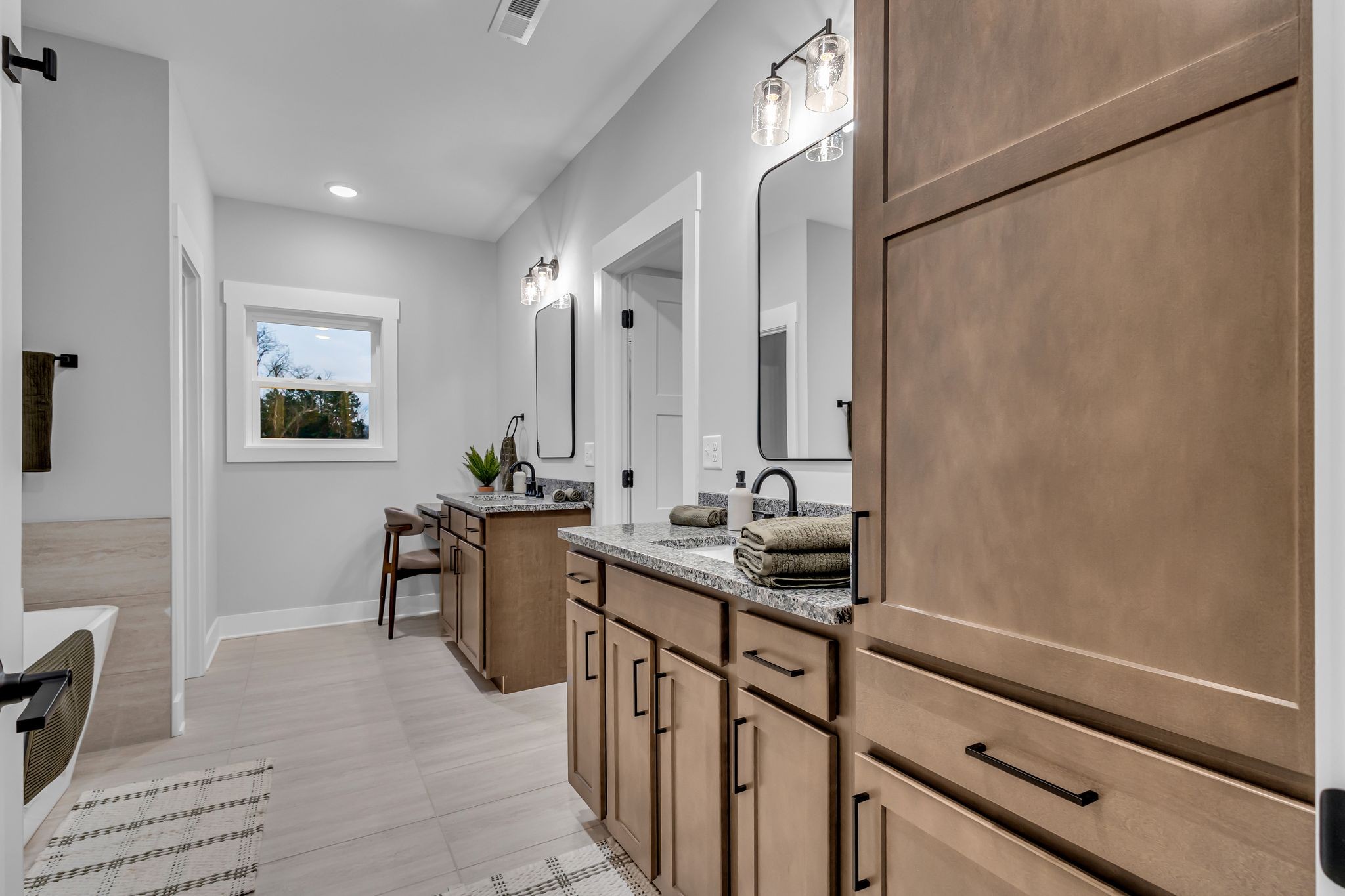 2504 Gentle Rain Road Knoxville, TN 37920 - Photo 32 of 45 a bathroom with a sink a mirror and a bathtub