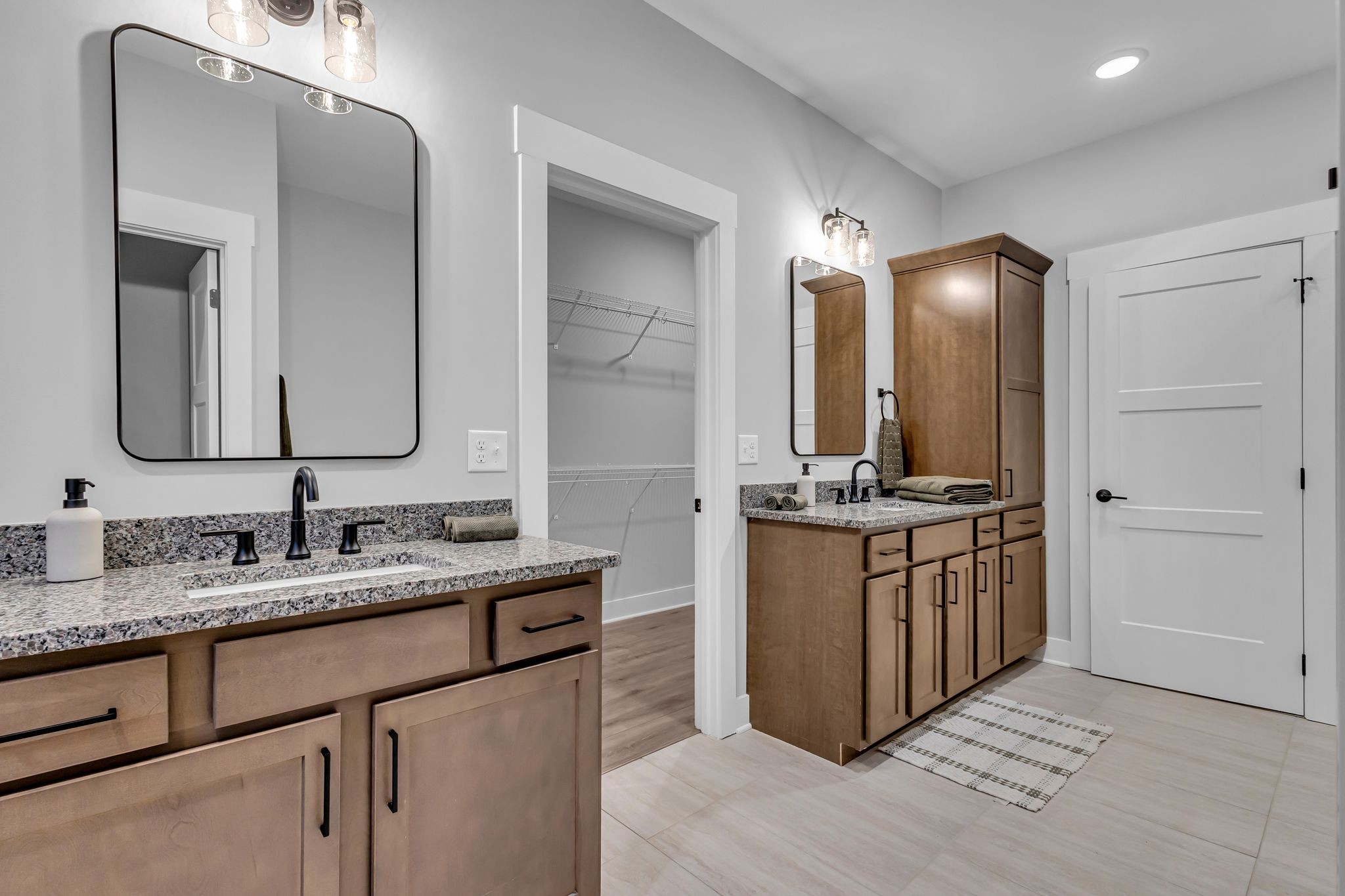 2504 Gentle Rain Road Knoxville, TN 37920 - Photo 34 of 45 a bathroom with a double vanity sink and a mirror