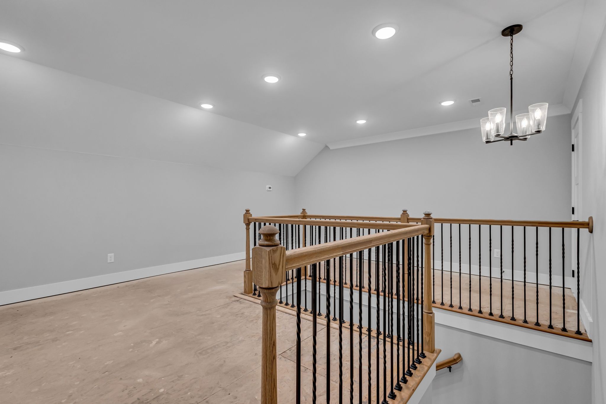 2504 Gentle Rain Road Knoxville, TN 37920 - Photo 39 of 45 a view of staircase with railing and a chandelier