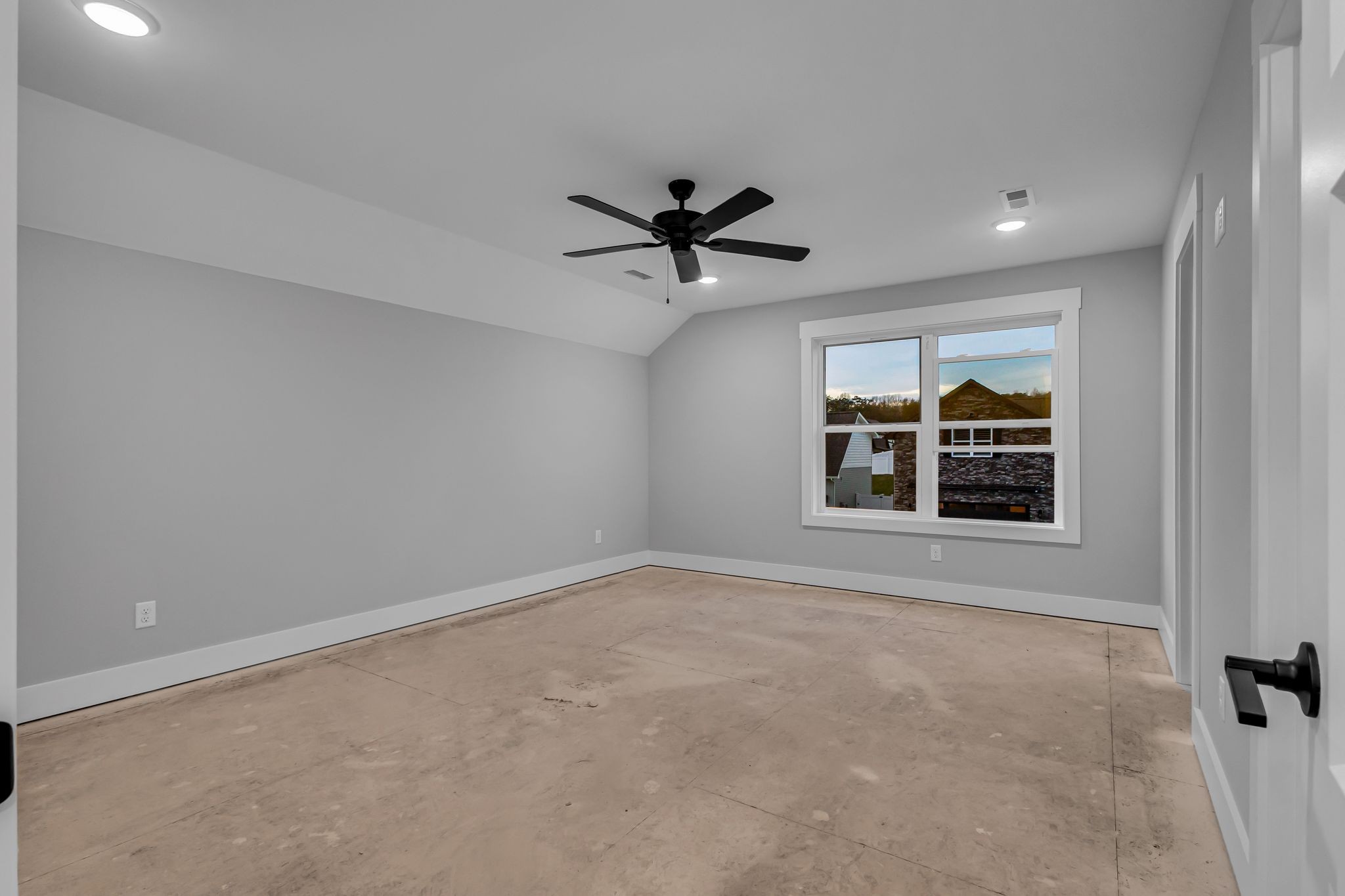2504 Gentle Rain Road Knoxville, TN 37920 - Photo 41 of 45 an empty room with chandelier fan and windows
