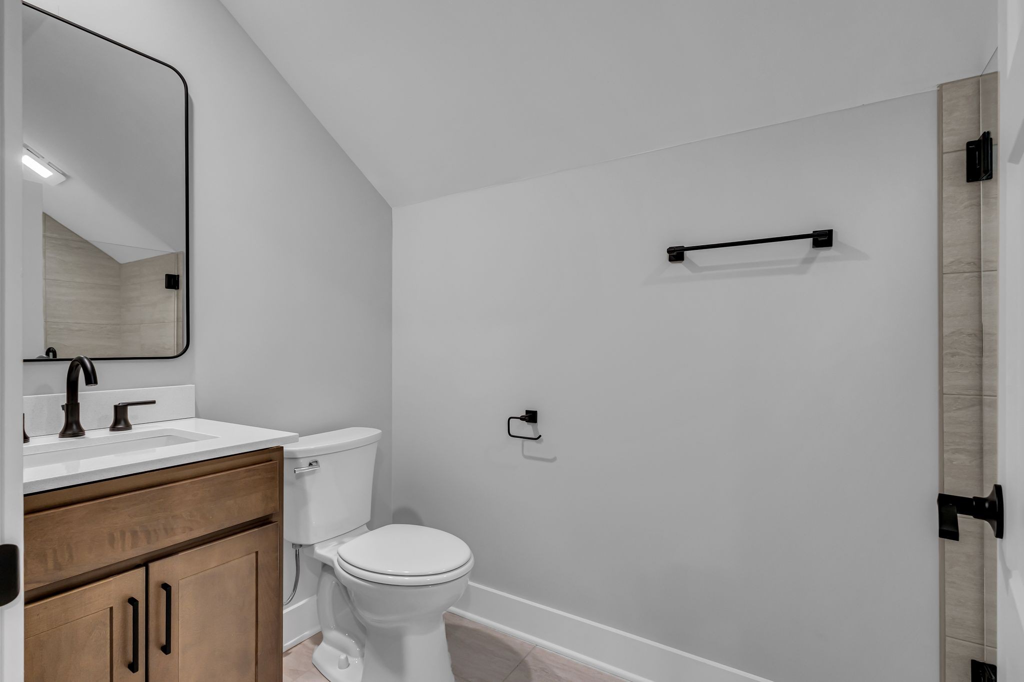 2504 Gentle Rain Road Knoxville, TN 37920 - Photo 44 of 45 a bathroom with a toilet sink and mirror
