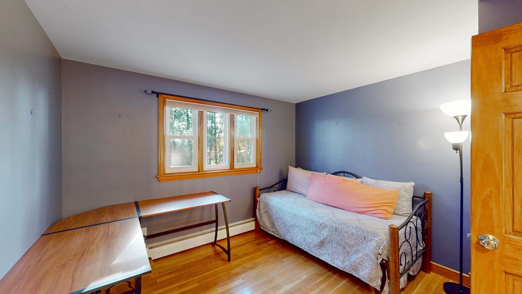 13 West Street Woburn, MA 01801 - Photo 11 of 30 a bedroom with a bed and a window