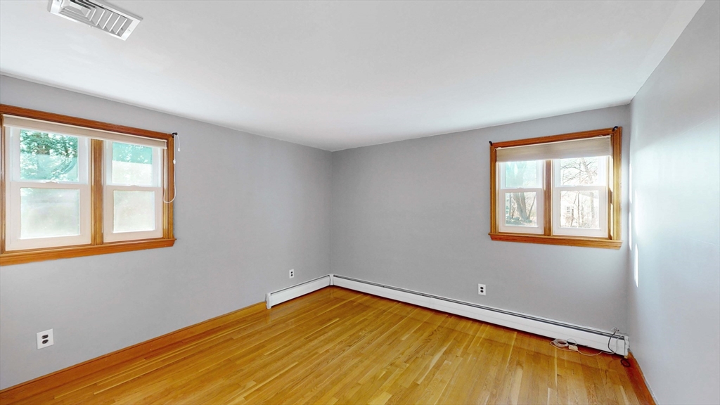 13 West Street Woburn, MA 01801 - Photo 14 of 30 a view of a room with wooden floor and a window