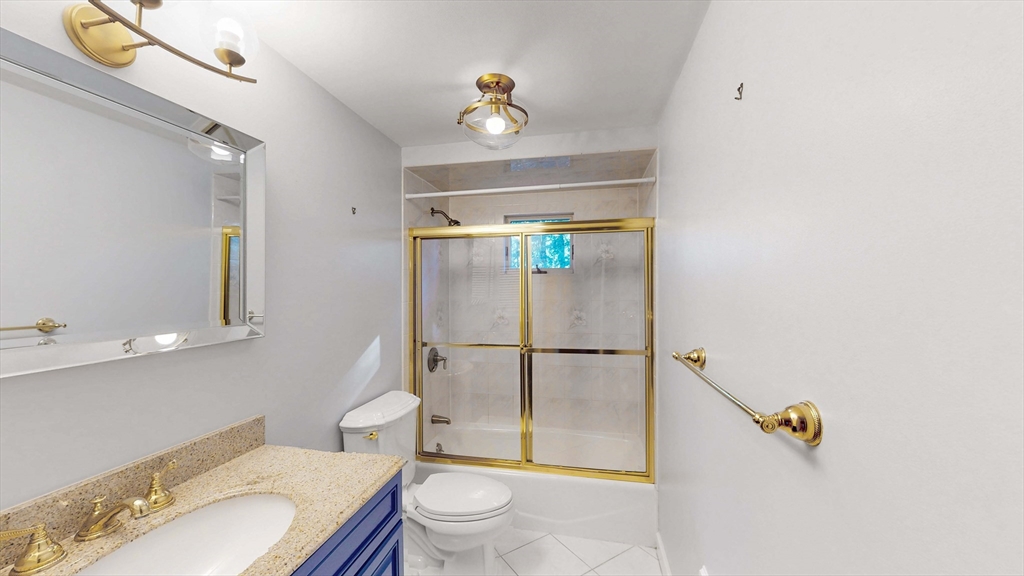 13 West Street Woburn, MA 01801 - Photo 16 of 30 a bathroom with a sink toilet and shower