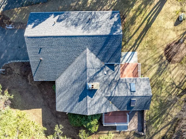 a view of house with a trees in the background