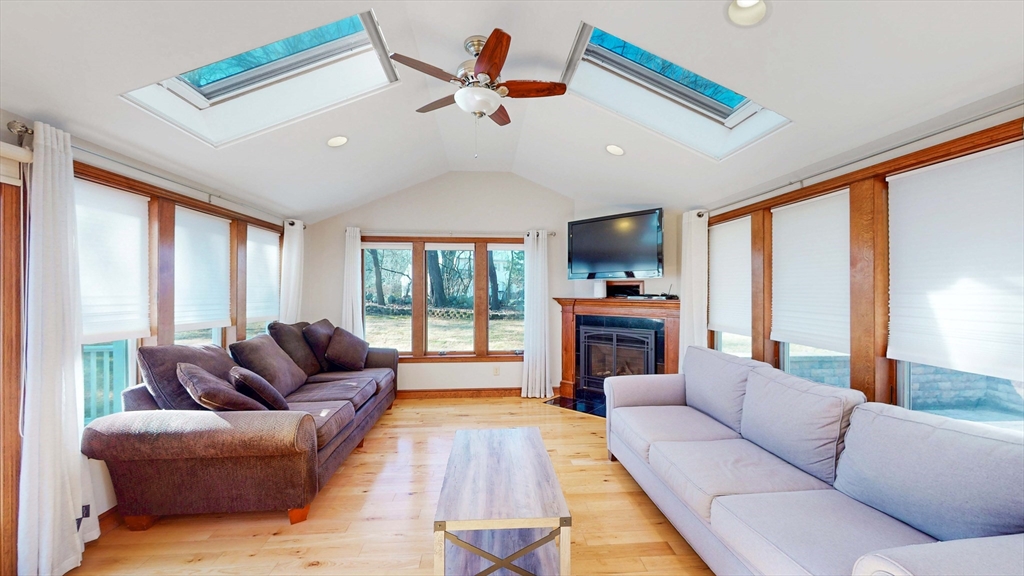 13 West Street Woburn, MA 01801 - Photo 6 of 30 a living room with furniture fireplace and flat screen tv