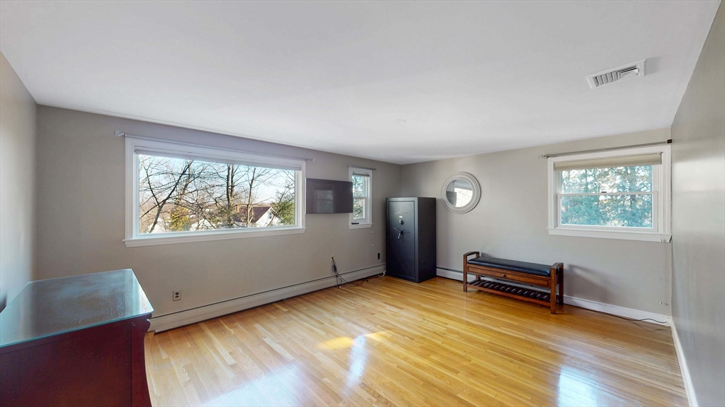 13 West Street Woburn, MA 01801 - Photo 7 of 30 a view of room with window and wooden floor