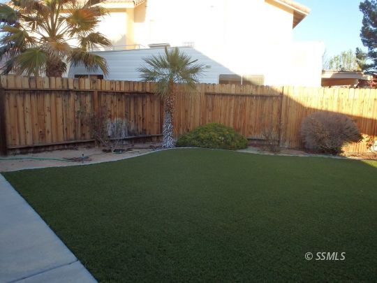 421 Marlene Court Ridgecrest, CA 93555 - Photo 42 of 50 a backyard of a house with lots of green space