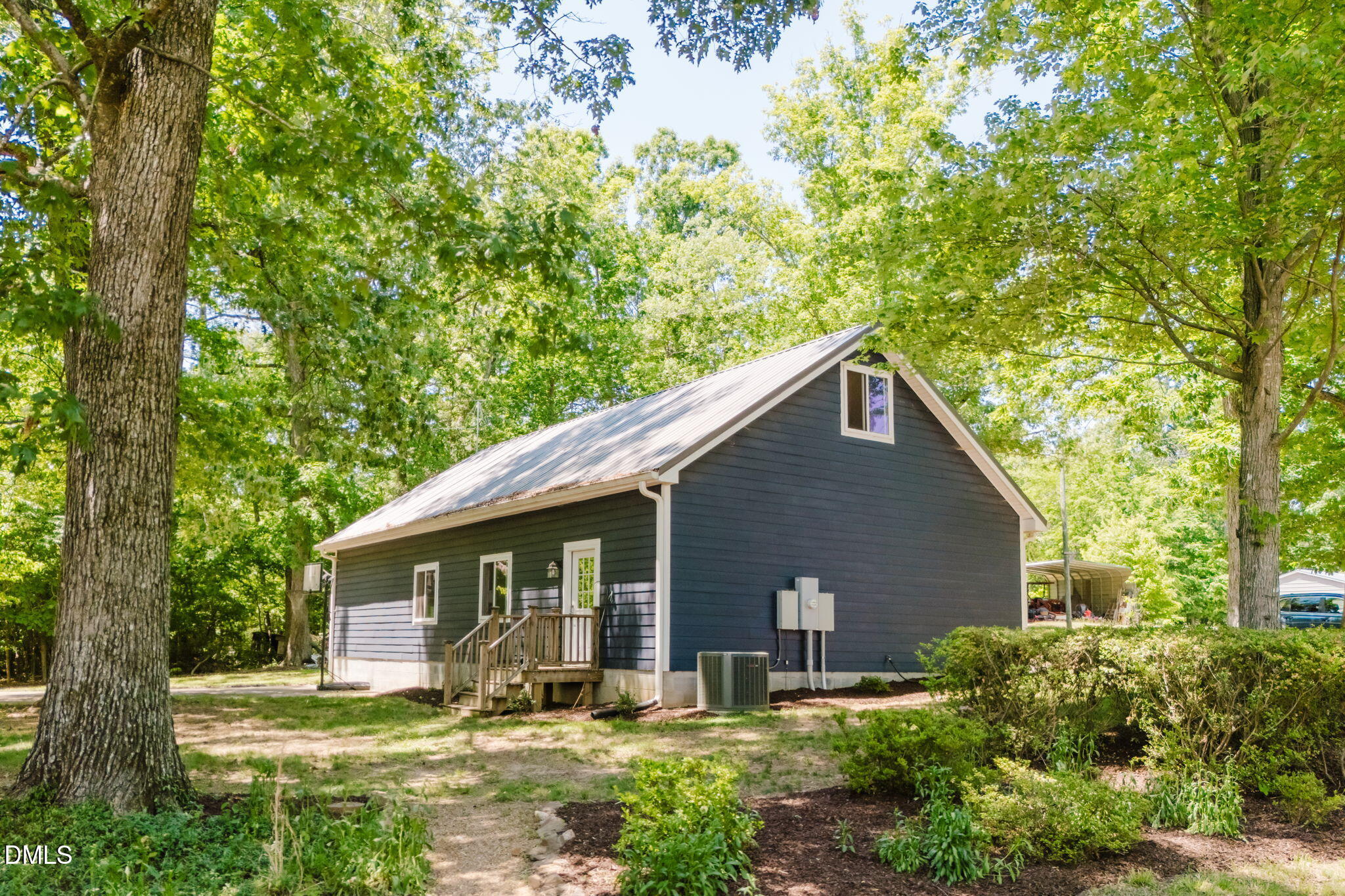 370 Robinson Ferry Road Macon, NC 27551 - Photo 13 of 85 a view of a house with yard and plants