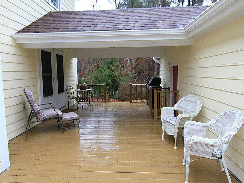 116 Hartland Court Raleigh, NC 27614 - Photo 23 of 25 Part of the deck is covered and other part is open. Great use of outdoor space between house and garage. Does not get a lot of the heat from the afternoon so you can enjoy cooking out and eating on this deck. Covered space entering home. Deck