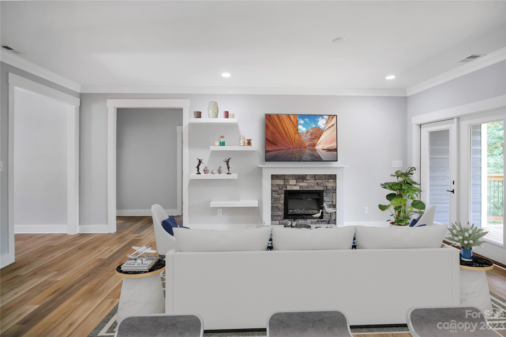 7550 Webbs Road Denver, NC 28037 - Photo 13 of 46 a living room with furniture and a fireplace