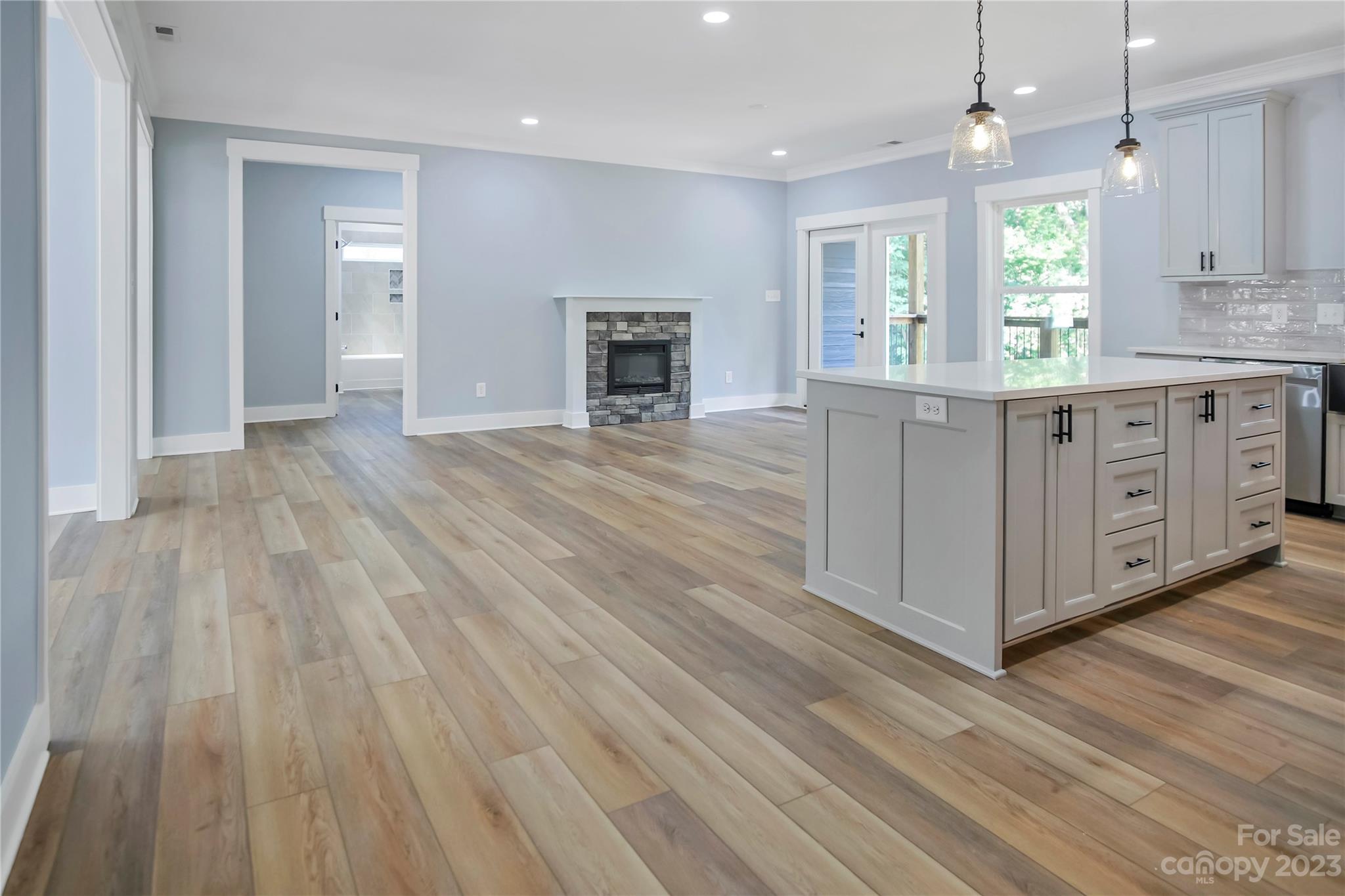 7550 Webbs Road Denver, NC 28037 - Photo 20 of 46 wooden floor with white cabinets and wooden floor