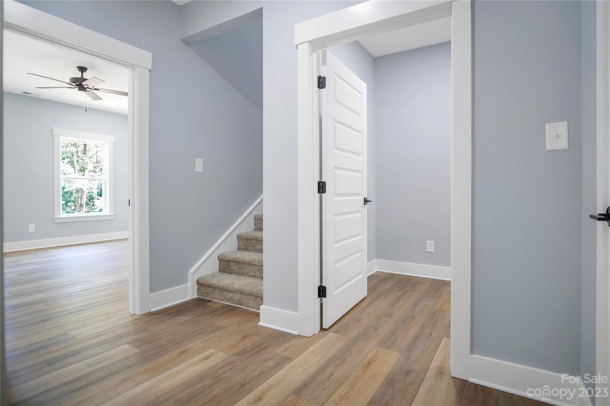 7550 Webbs Road Denver, NC 28037 - Photo 22 of 46 a view of a hallway with wooden floor and staircase