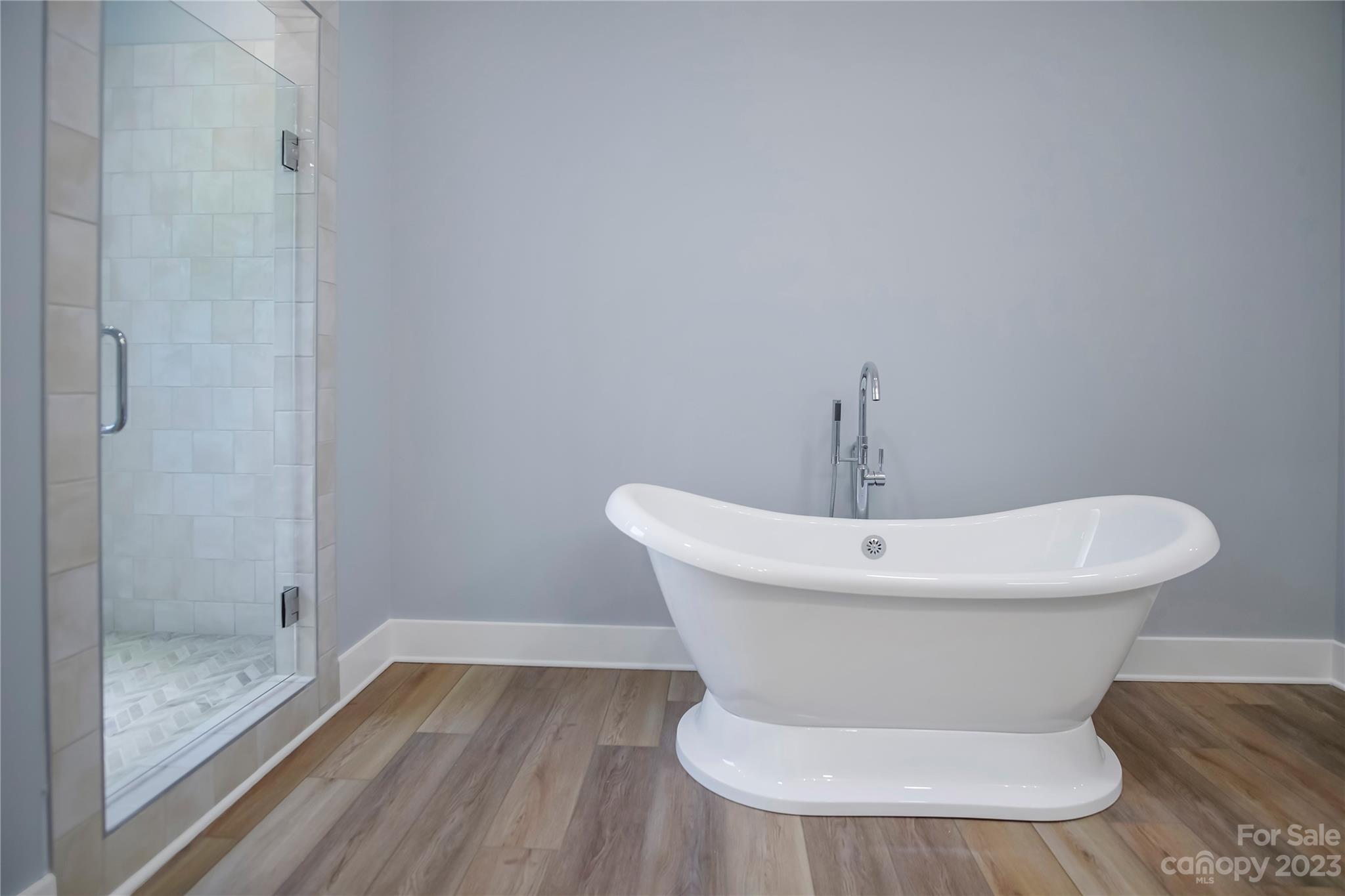 7550 Webbs Road Denver, NC 28037 - Photo 25 of 46 a white bath tub sitting in a bathroom
