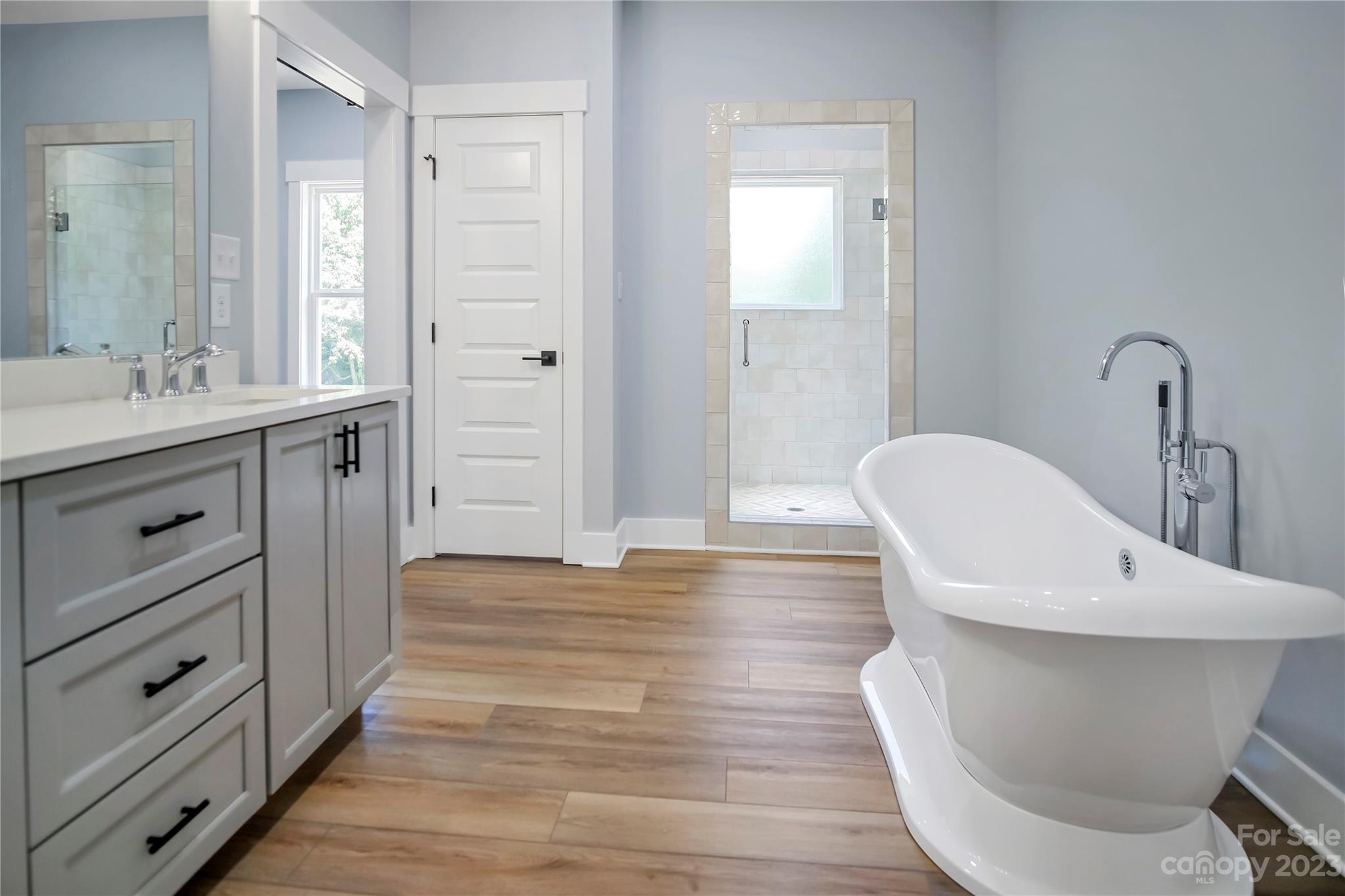 7550 Webbs Road Denver, NC 28037 - Photo 26 of 46 a bathroom with a sink and a mirror