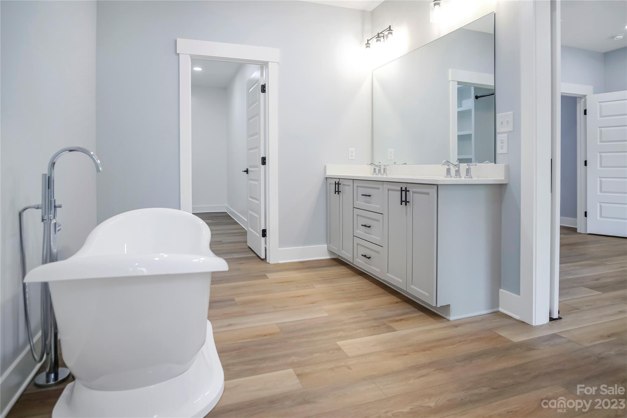7550 Webbs Road Denver, NC 28037 - Photo 27 of 46 a bathroom with a sink a toilet and mirror