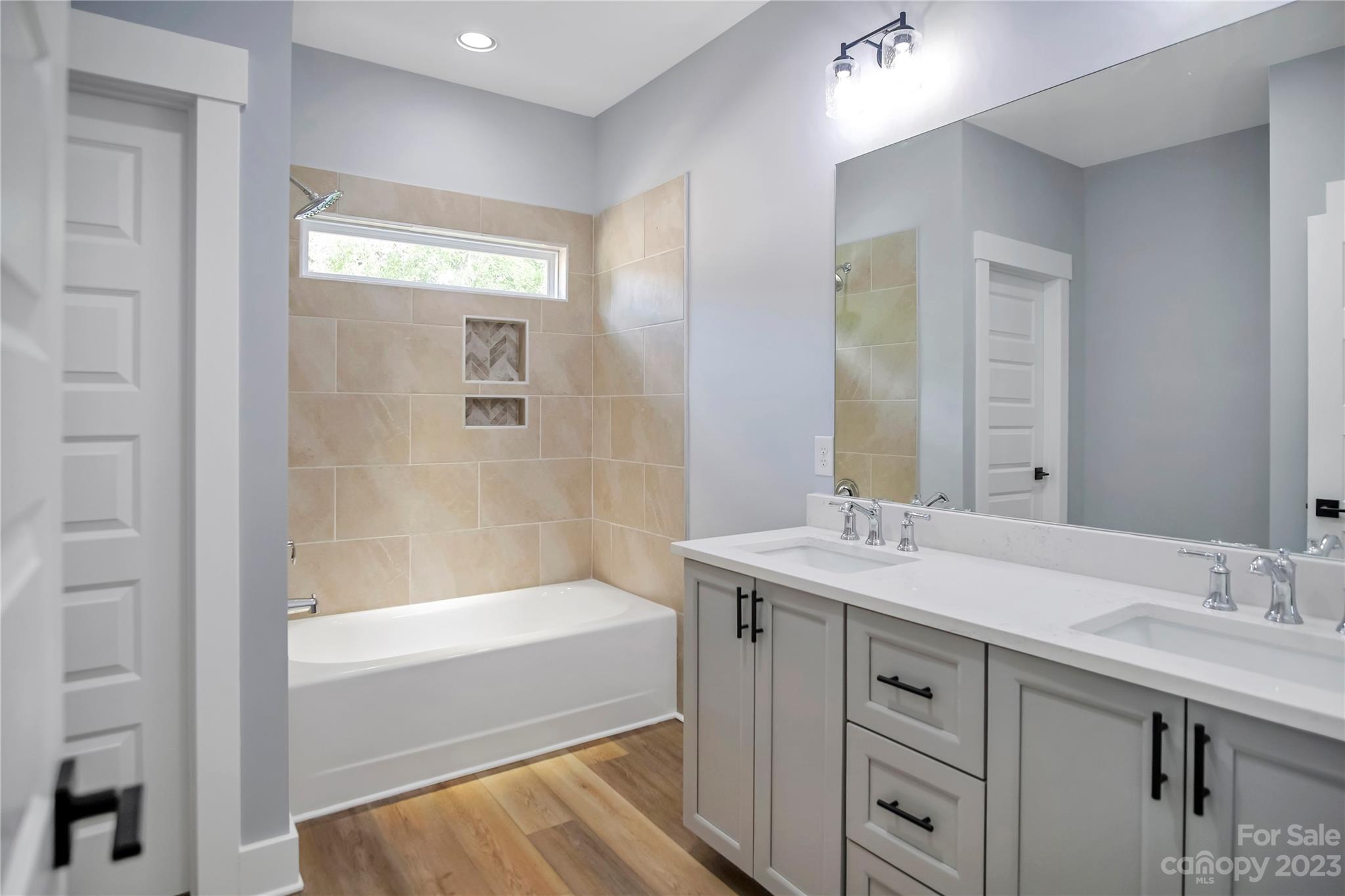 7550 Webbs Road Denver, NC 28037 - Photo 35 of 46 a bathroom with a tub sink and mirror