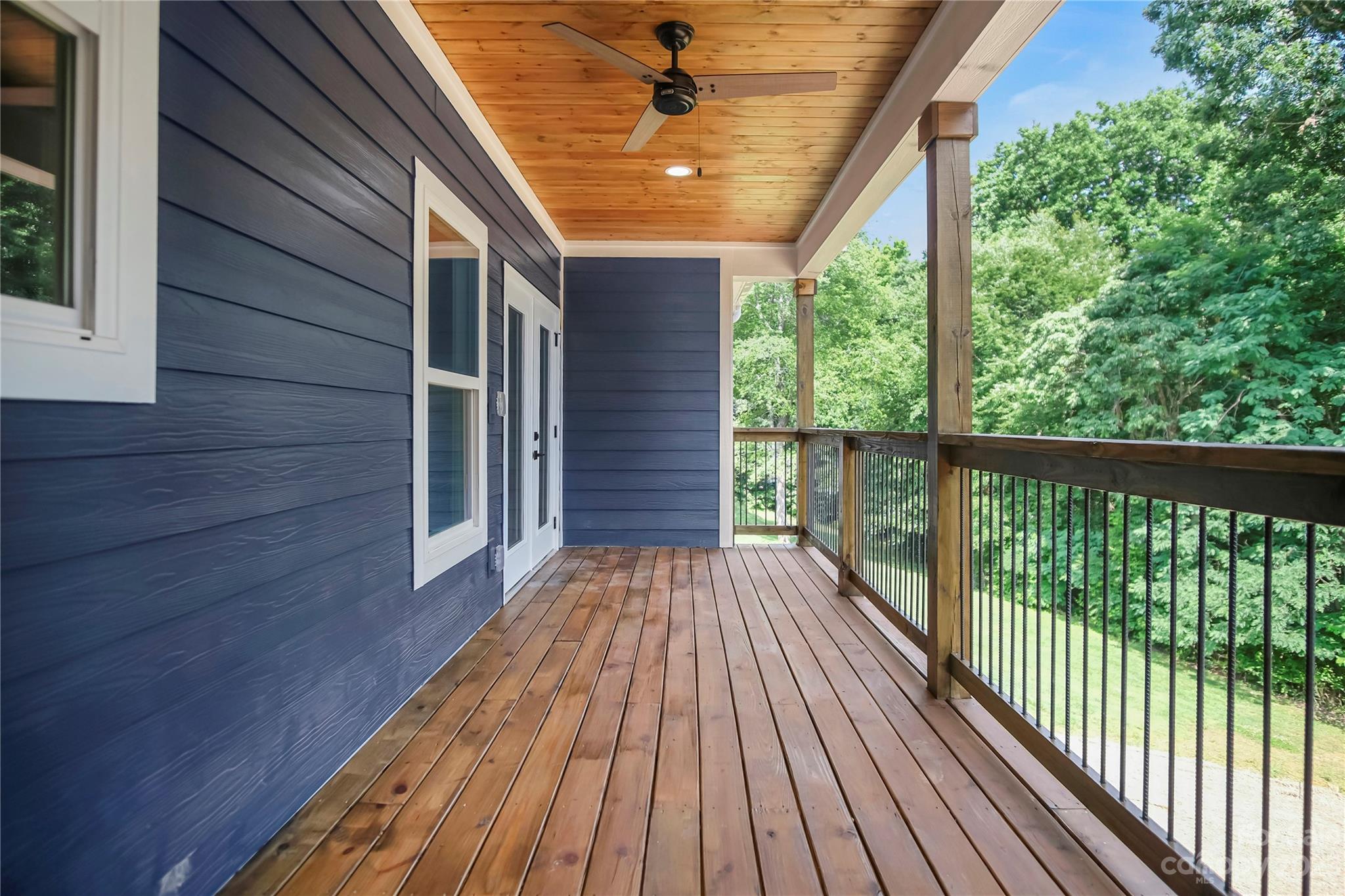 7550 Webbs Road Denver, NC 28037 - Photo 40 of 46 a view of backyard with a deck and wooden floor