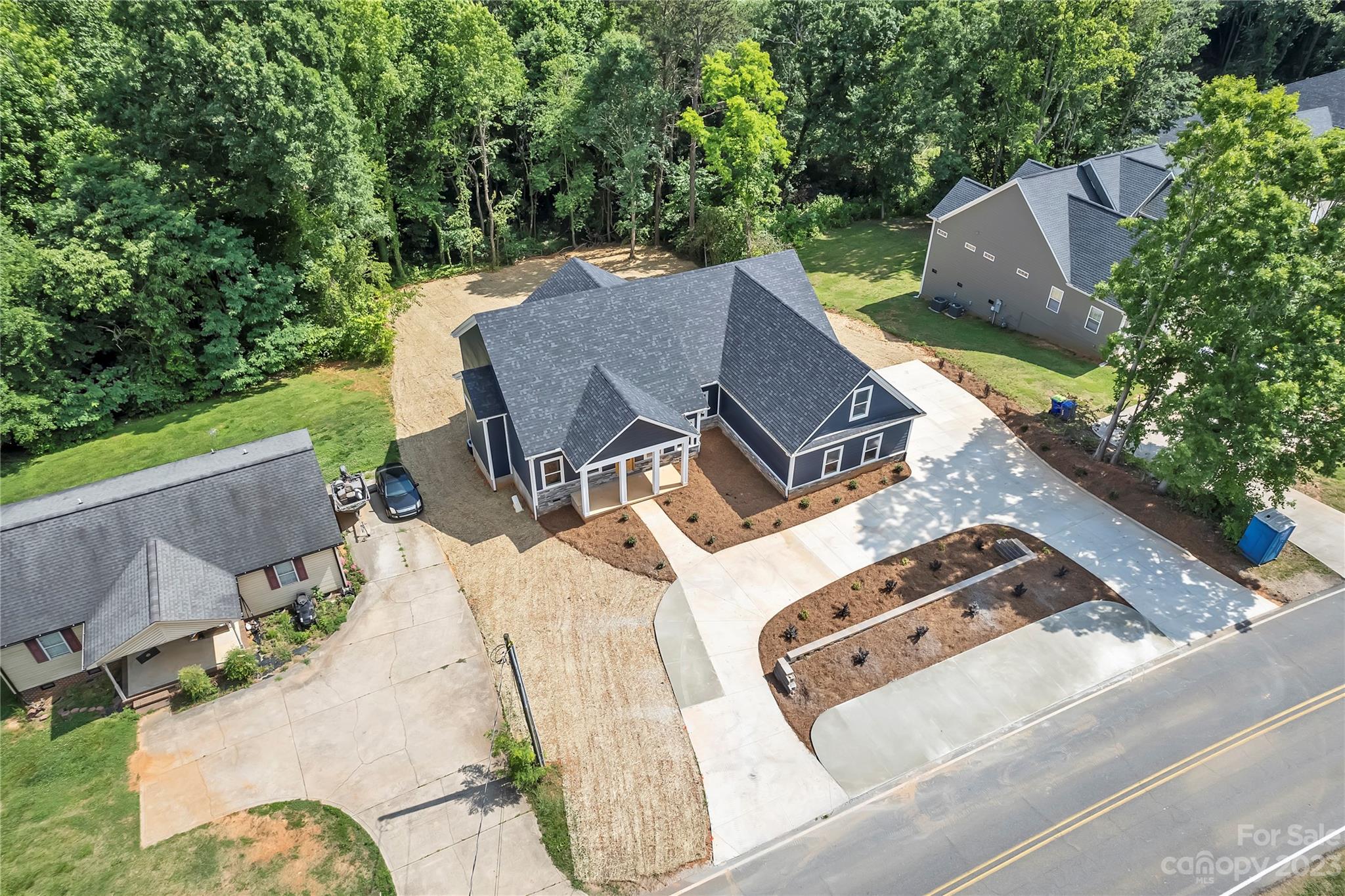 7550 Webbs Road Denver, NC 28037 - Photo 41 of 46 an aerial view of a house with outdoor space and trees all around