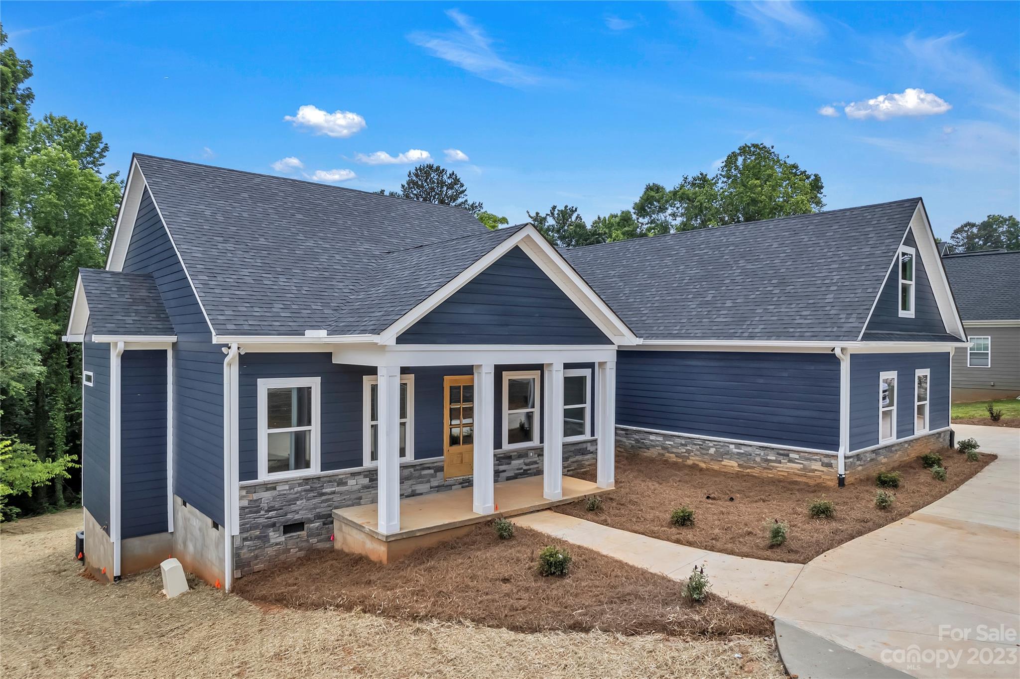 7550 Webbs Road Denver, NC 28037 - Photo 43 of 46 a view of a house with a yard and potted plants
