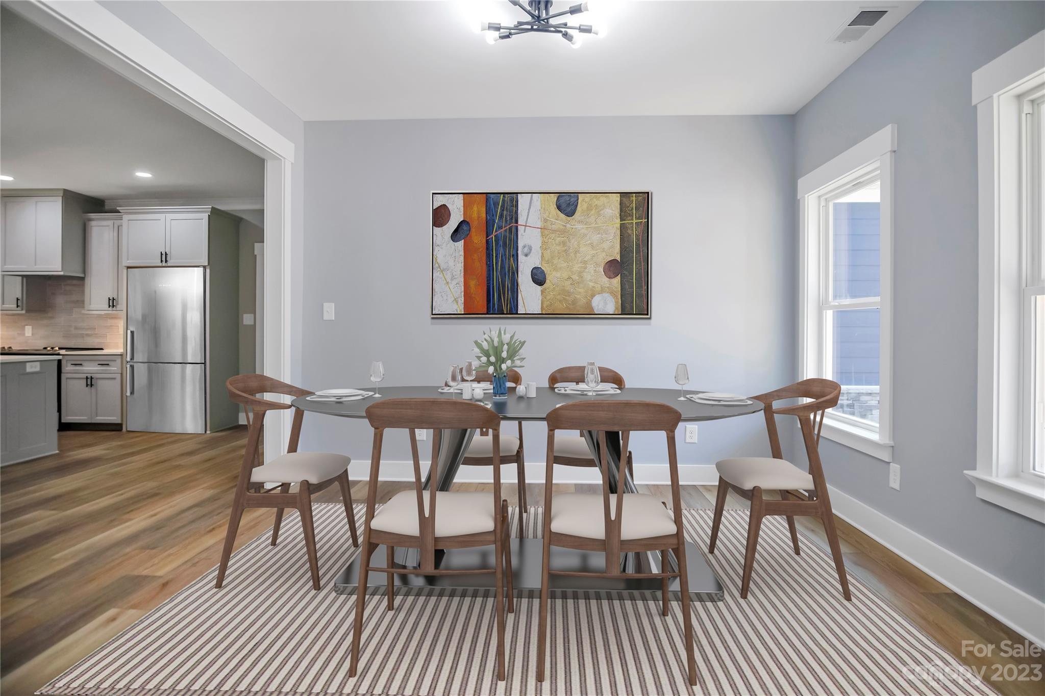 7550 Webbs Road Denver, NC 28037 - Photo 6 of 46 a view of a dining room with furniture and wooden floor