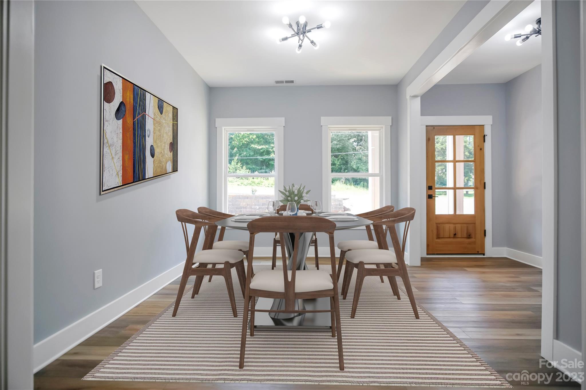7550 Webbs Road Denver, NC 28037 - Photo 7 of 46 a view of a dining room with furniture window and wooden floor