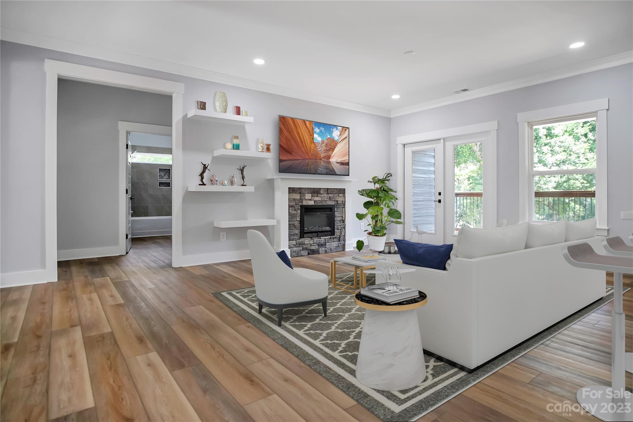 7550 Webbs Road Denver, NC 28037 - Photo 9 of 46 a living room with furniture and a fireplace