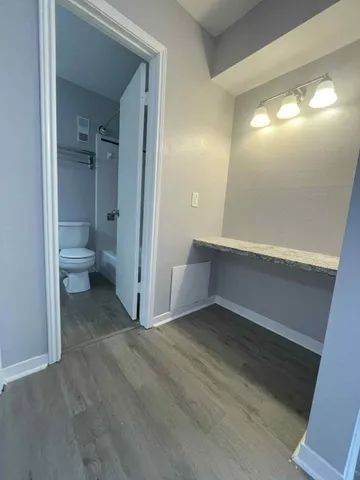 a view of a hallway with a room