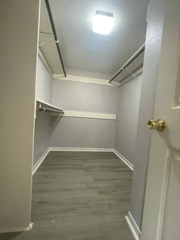 a view of an empty walk in closet