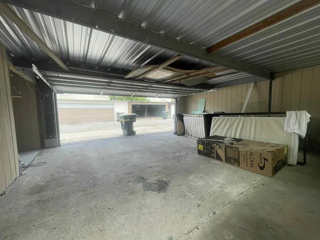 a view of an empty room with storage