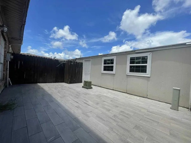 a view of a house with a yard and a garage