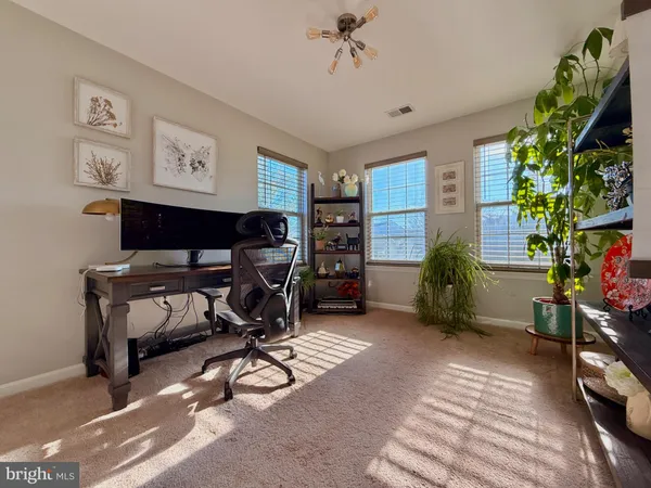 a view of a workspace with furniture