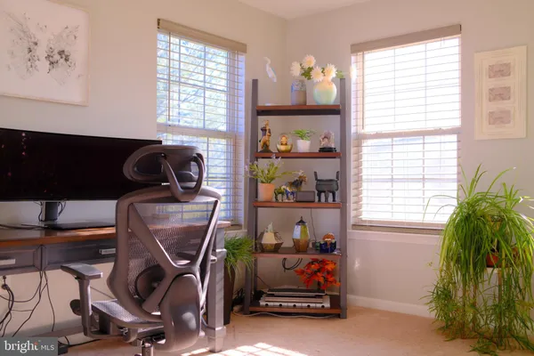 a room with gym equipment and a window