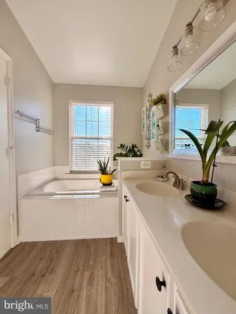 a kitchen with a sink and a refrigerator