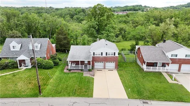 a aerial view of a house with table and chairs