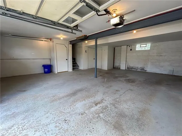 a front view of a house with a garden and deck