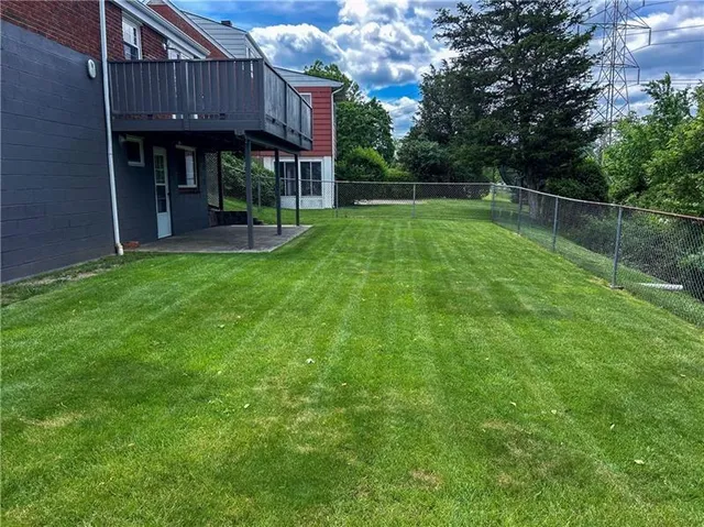 a view of a house with a big yard