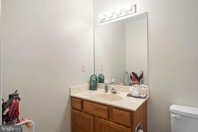 a bathroom with a sink vanity and a mirror