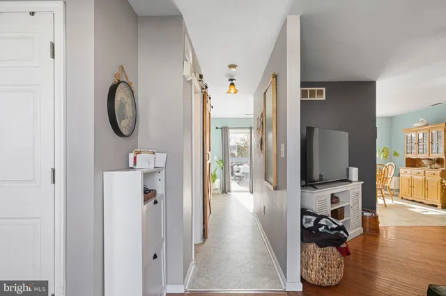 a view of living room with furniture and a flat screen tv