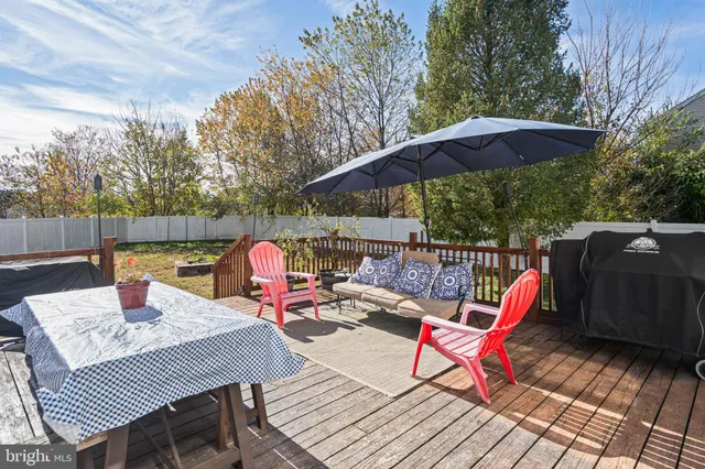 a view of deck with wooden floor and outdoor seating
