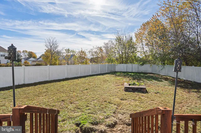 a view of a backyard with sitting area